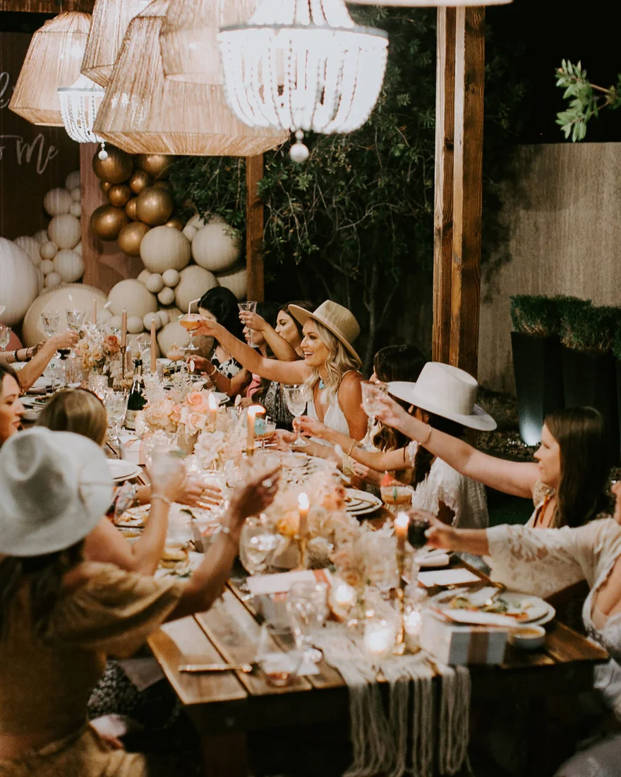 Friends gathered around a celebration table