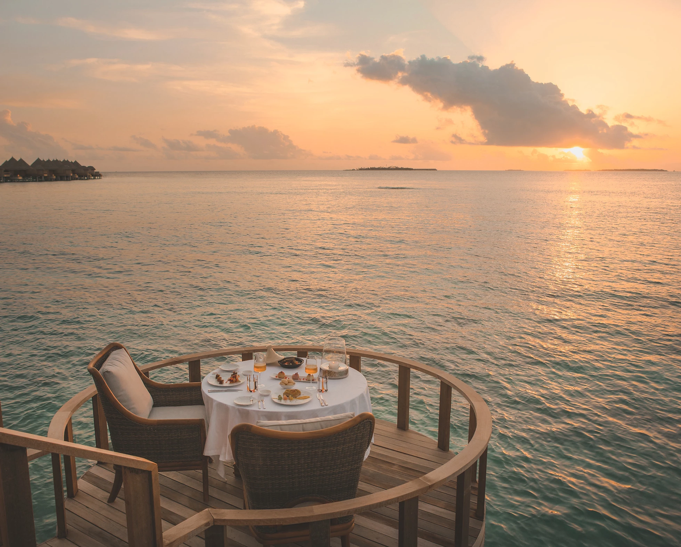 A table overlooking the ocean at sunset