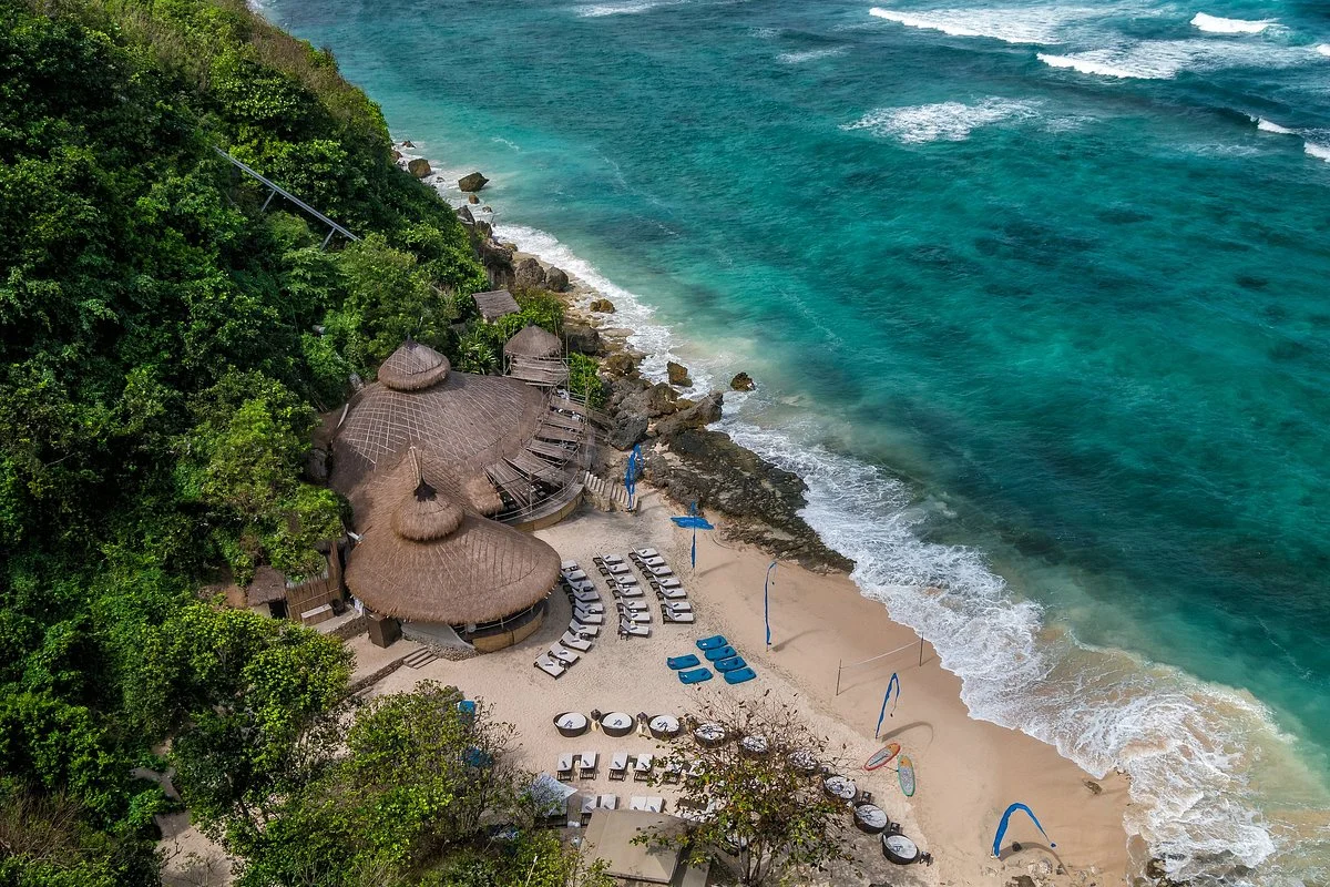 A secluded coastal resort set above turquoise water