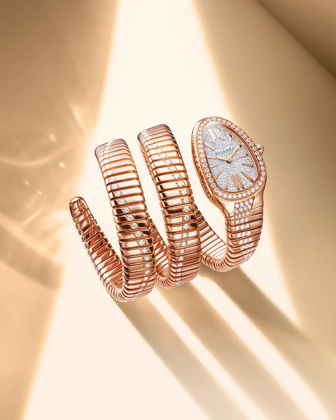 Gold jewellery displayed in warm natural light